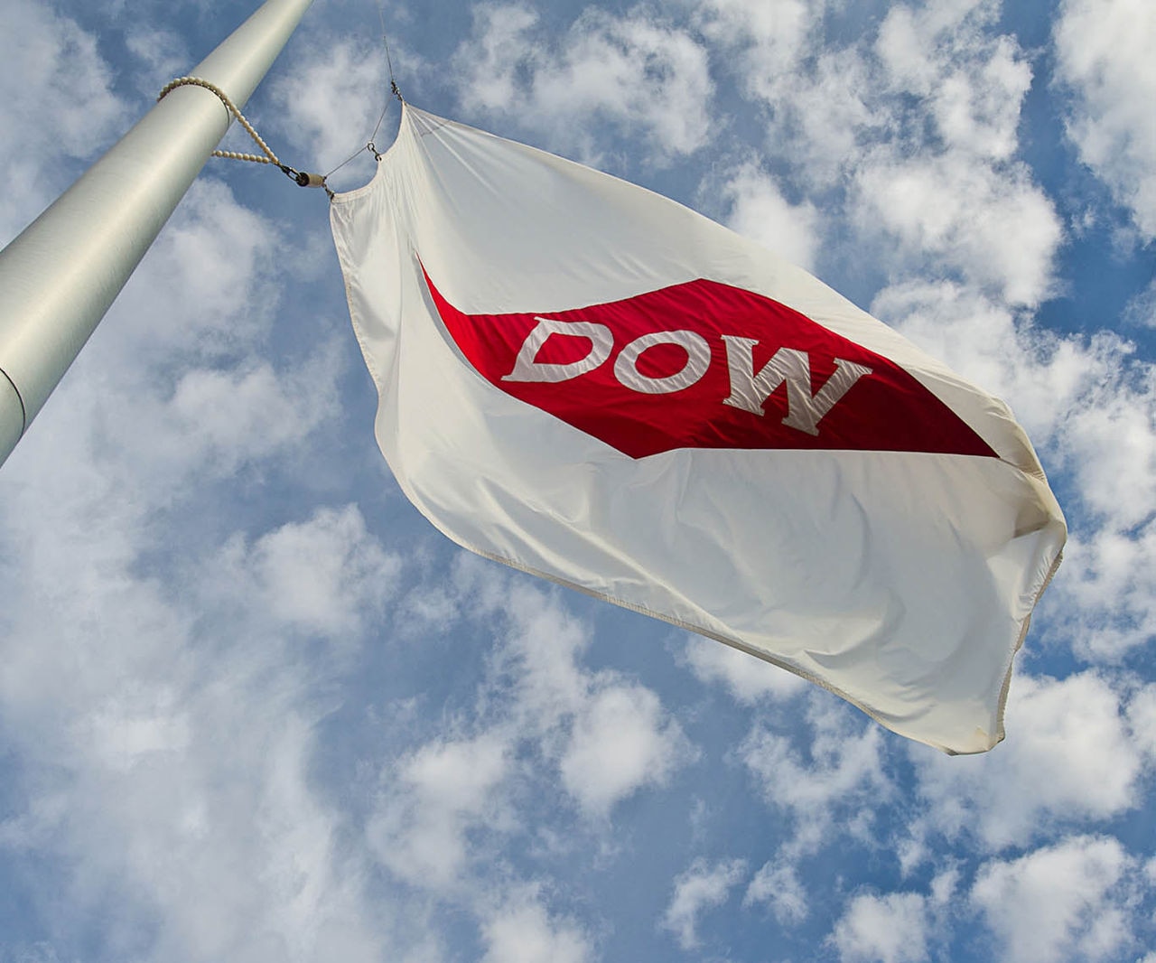 Dow flag cloudy blue sky
