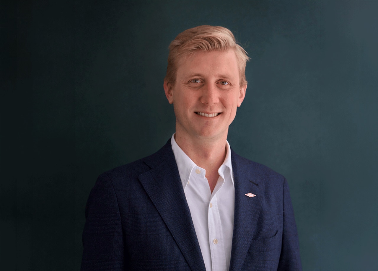 Alveda Williams wearing a purple jacket